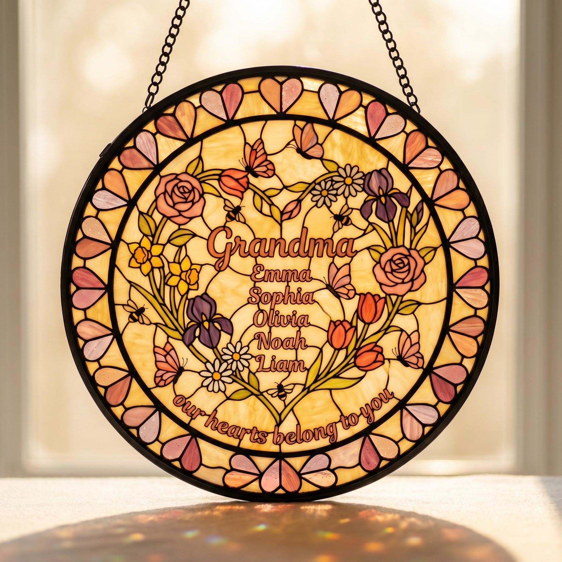 Custom heart-shaped flower suncatcher glowing in bright sunroom conservatory surrounded by monstera and pothos houseplants
