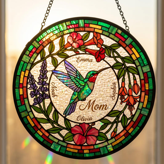 Hummingbird birth flower suncatcher in living room with golden hour light creating prismatic reflections