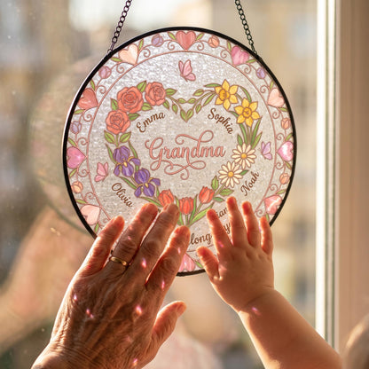 Close-up detail of heart garden suncatcher showing rose-gold outlines, pink rose petals, water-ripple glass texture