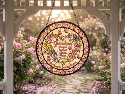 Artisan heart garden suncatcher detail showing bold black outlines and rich glass texture