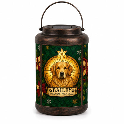 Front view of the personalized pet Christmas memorial solar lantern on a white background, showing the emerald stained-glass-style design, gold halo, star, poinsettias and name scroll