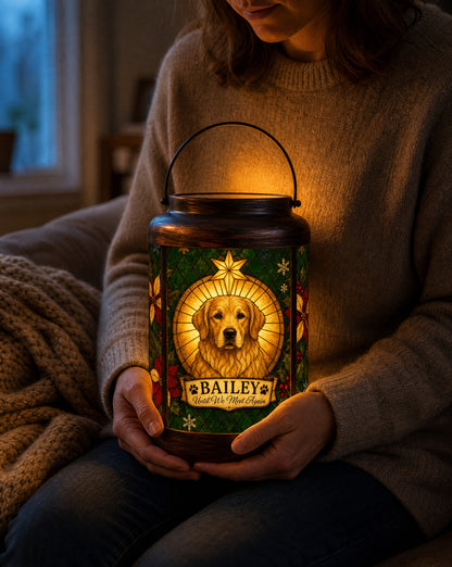 A woman holding a glowing personalized pet memorial Christmas lantern in her lap, a keepsake for the first Christmas after losing a dog