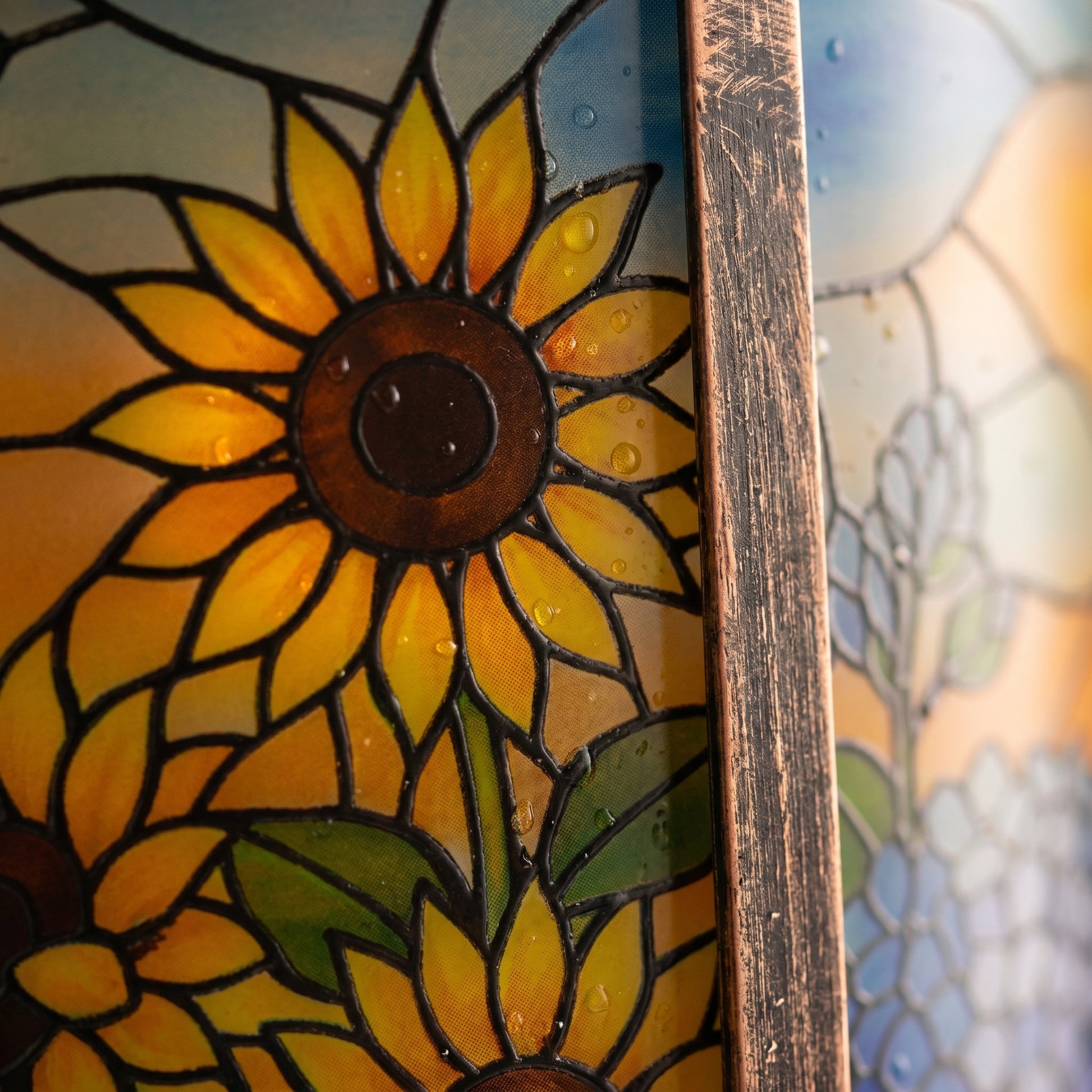 Close-up of the stained-glass-style panel and brushed antique bronze metal frame of the solar lantern